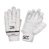 A pair of white cricket gloves shown against a plain white background, displaying both the back of the hand and the palm side. The gloves feature textured protective padding, breathable mesh, and a black and white 'SCC' logo on the wrist straps.