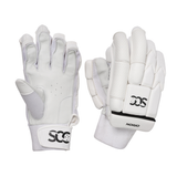 A pair of white cricket gloves shown against a plain white background, with one glove displaying the back of the hand and the other showing the palm side. The brand 'SCC' is clearly visible on the wrist strap of the left glove, and 'NO10' is visible on the back of the right glove.