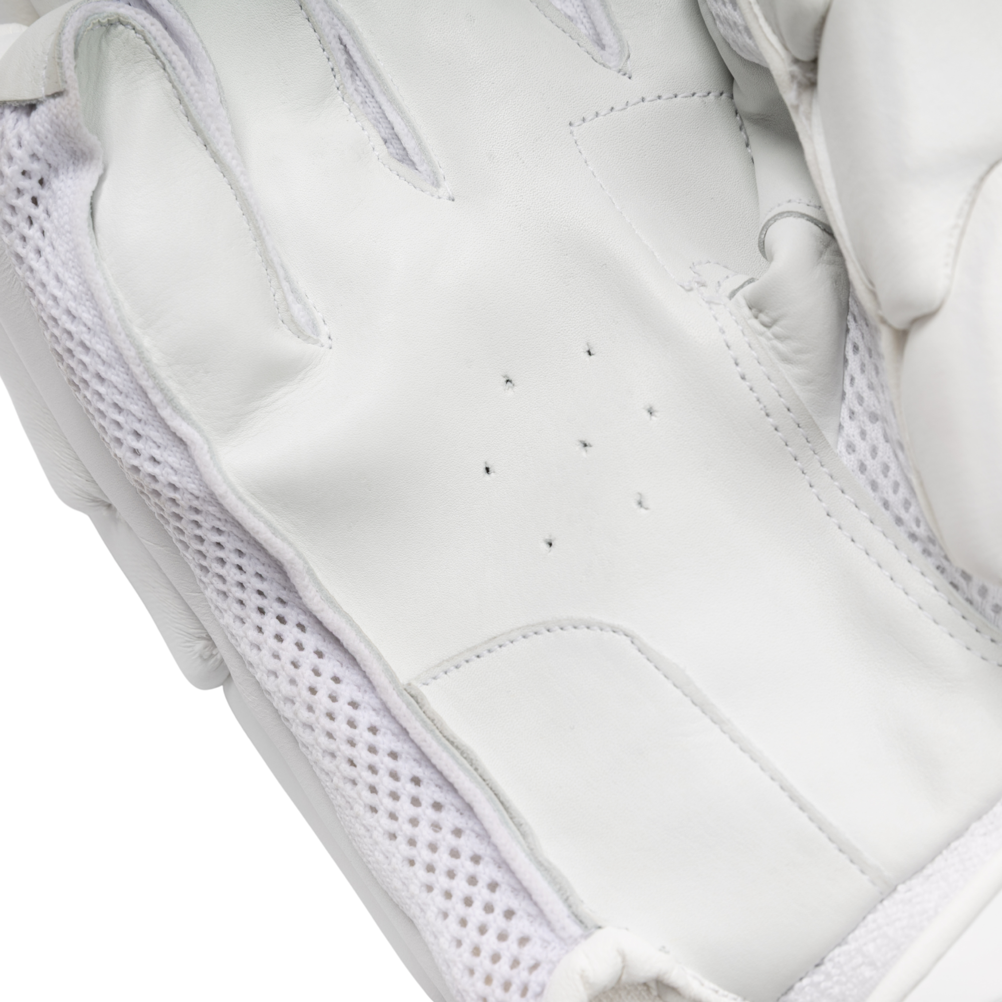Close-up of a white leather glove with white mesh lining and stitched details, showing the inner back of the hand.