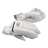 A pair of white cricket gloves with black logo details, displayed against a clean white background.