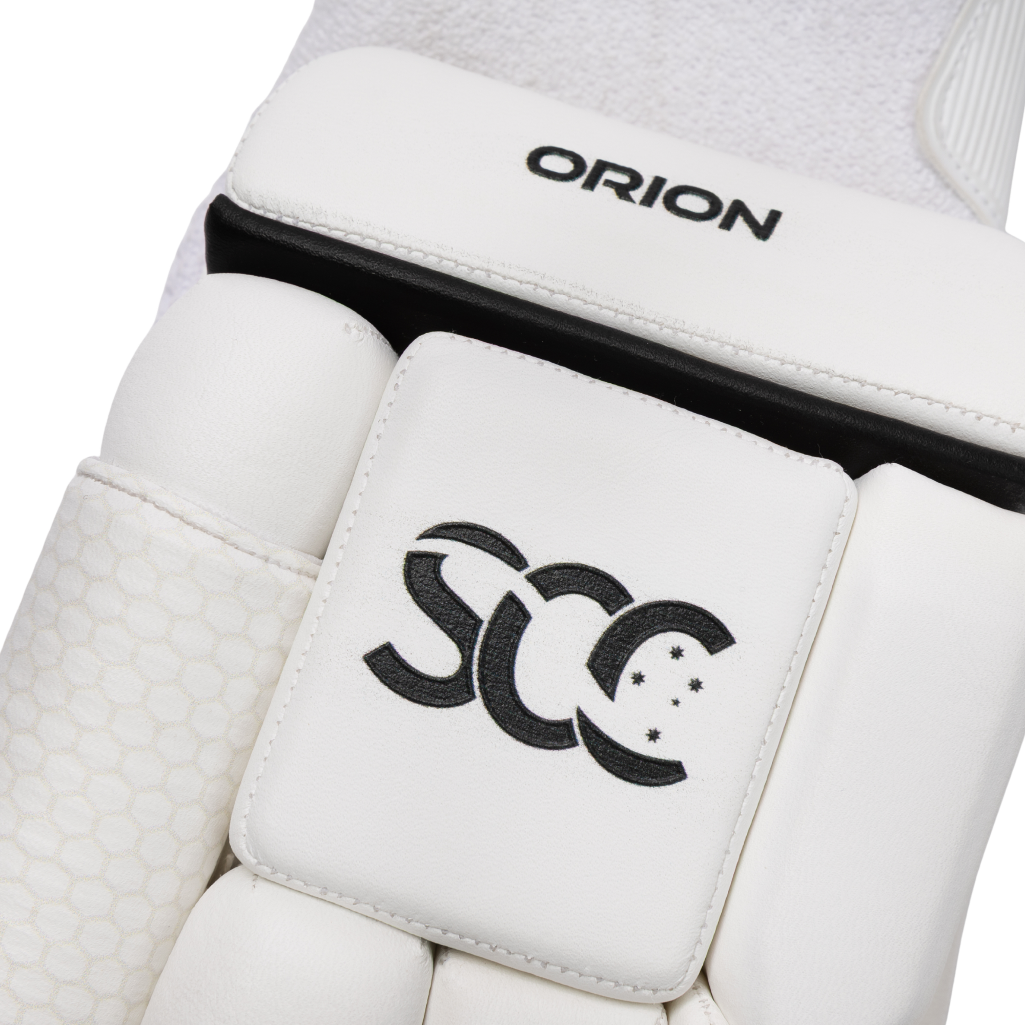 Close-up of a white sports protective pad with black branding, showing the word ORION on the upper section and a stylized SCC logo on the central pad.